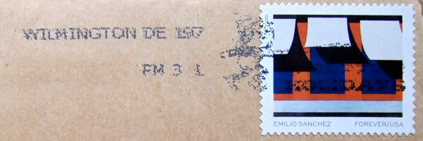 Photo of the top of a brown envelope with Jester Artspace return address and a stamp